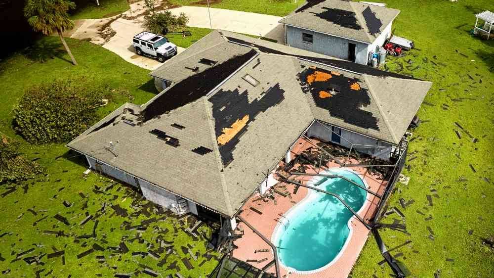 hurricane destroyed house roof in Florida. Needs emergency roof repair to prevent leaks