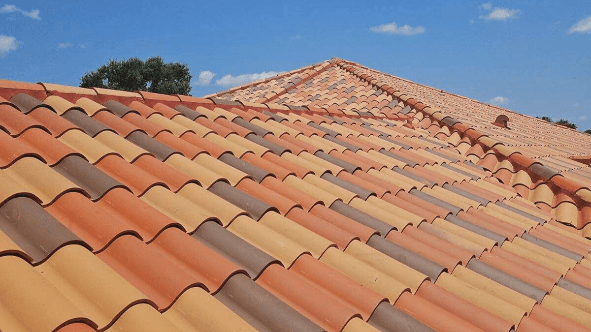 Colorful roof tiles from brown to red on a residential roof in Florida after a roof replacement