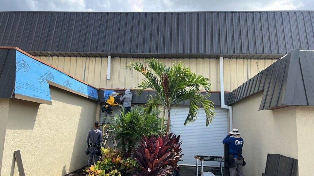 royalty roofers replacing metal roof on a business