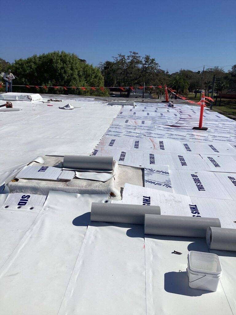 single-ply duro-last panels ready to be unrolled on a flat roof