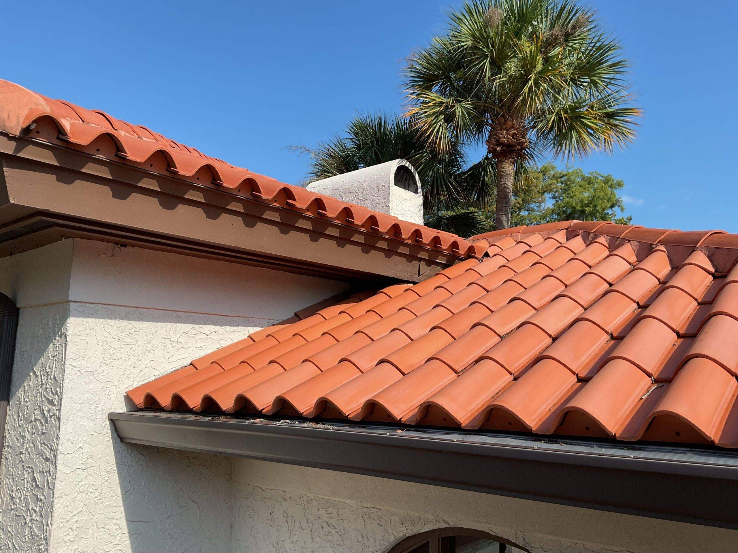 up close of newly installed orange clay spanish tile roof