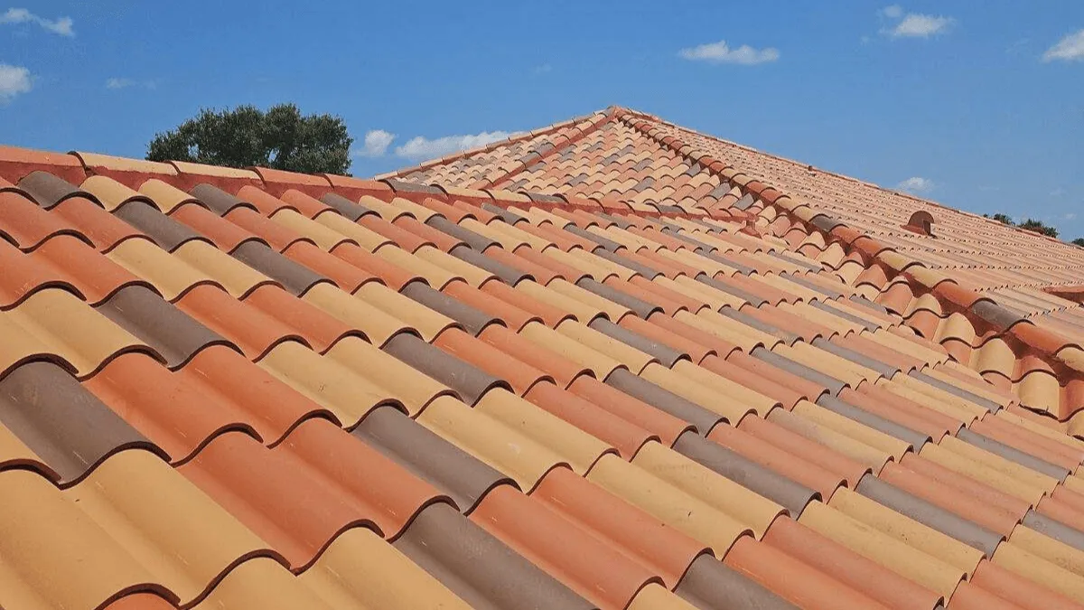 Colorful roof tiles from brown to red on a residential roof in Florida after a roof replacement