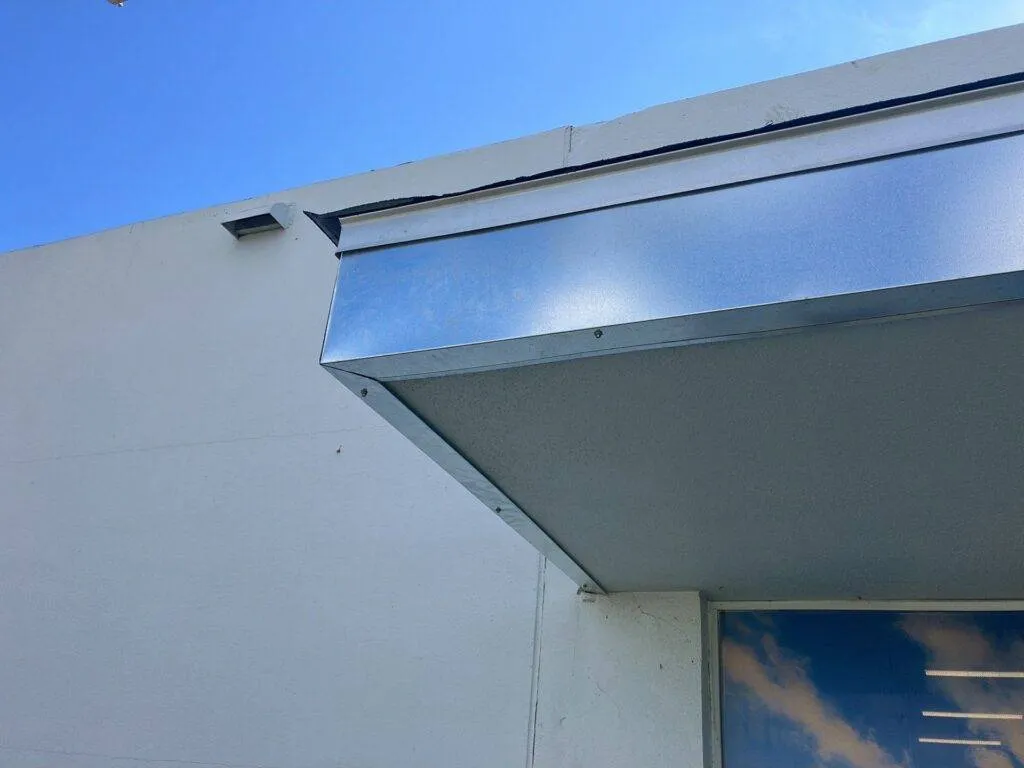 up close of a newly installed box gutter on a business