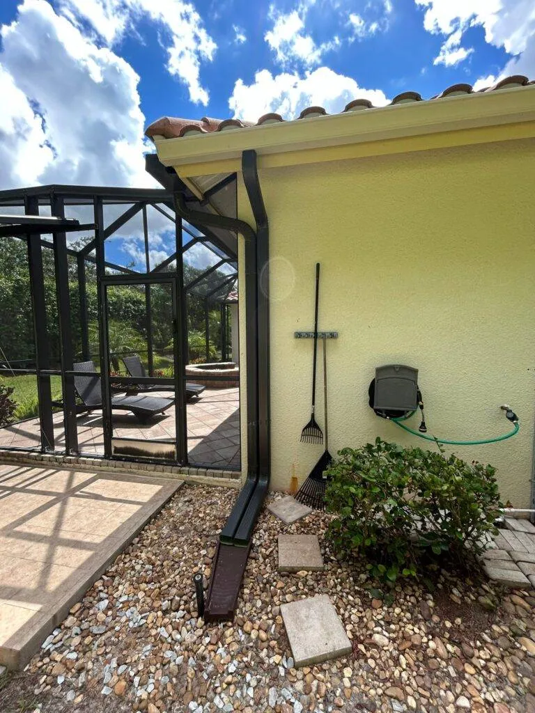 black gutters and downspout on home